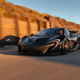 A black McLaren P1 hypercar driving at sunset
